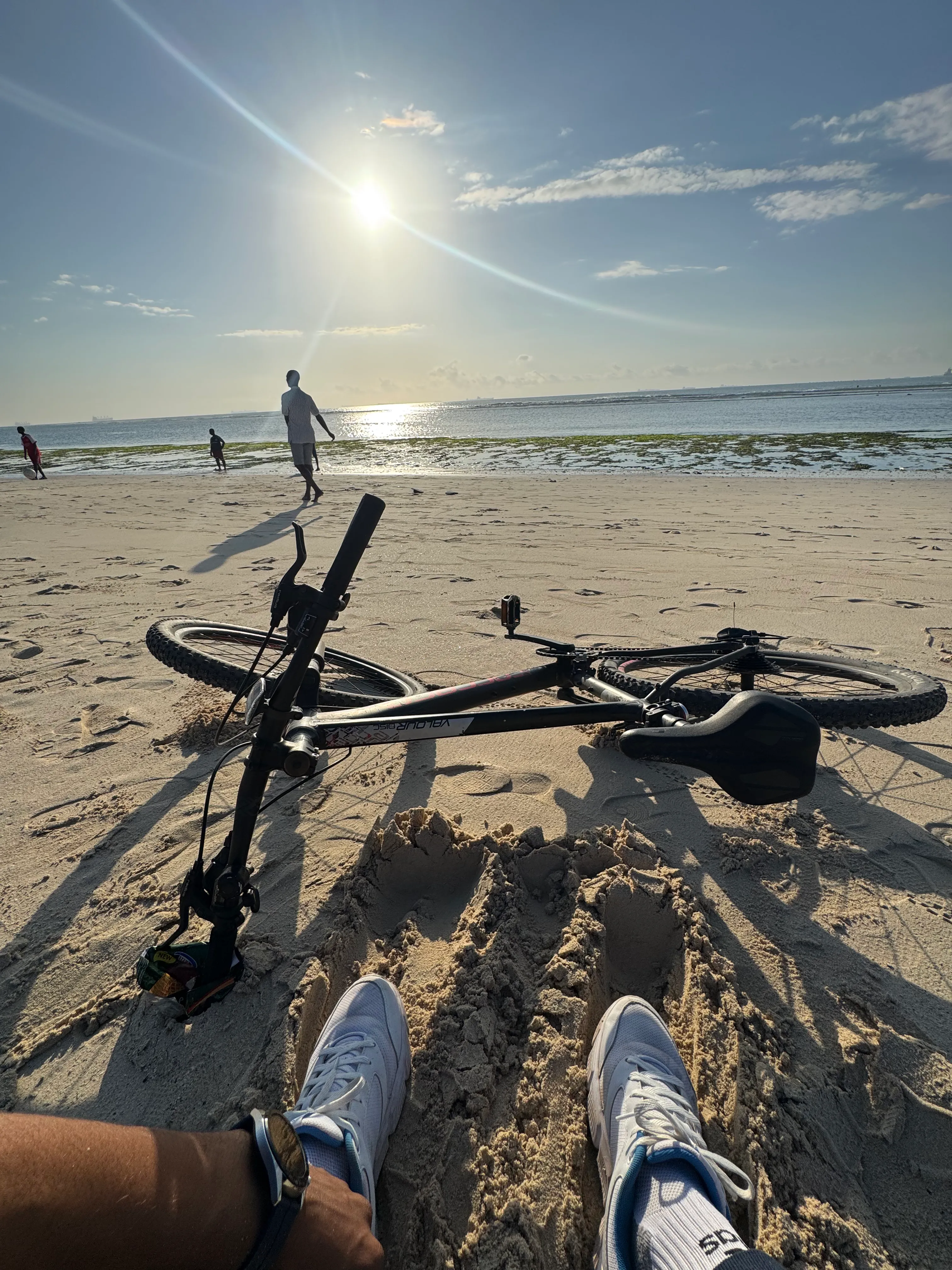 Rohit at the beach with a bicycle